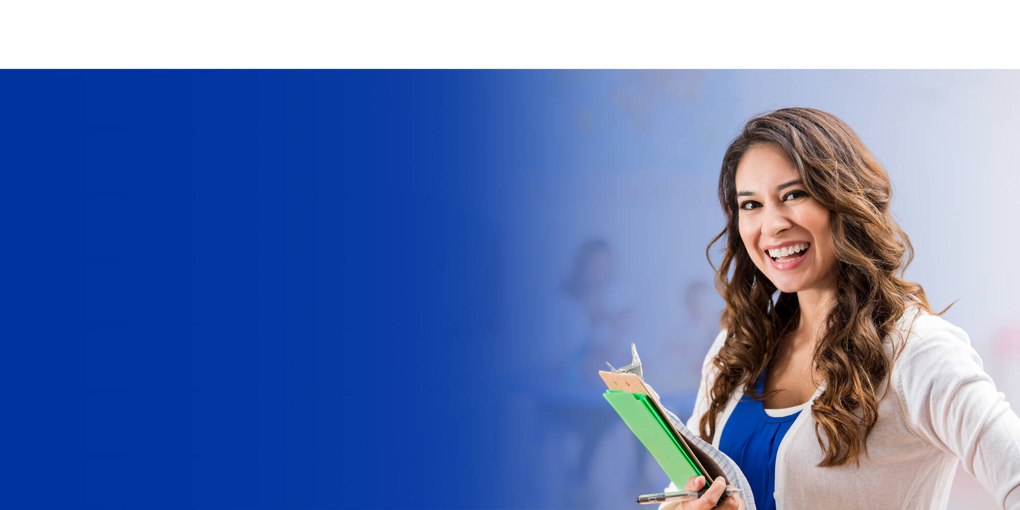 Educator holding notebooks
